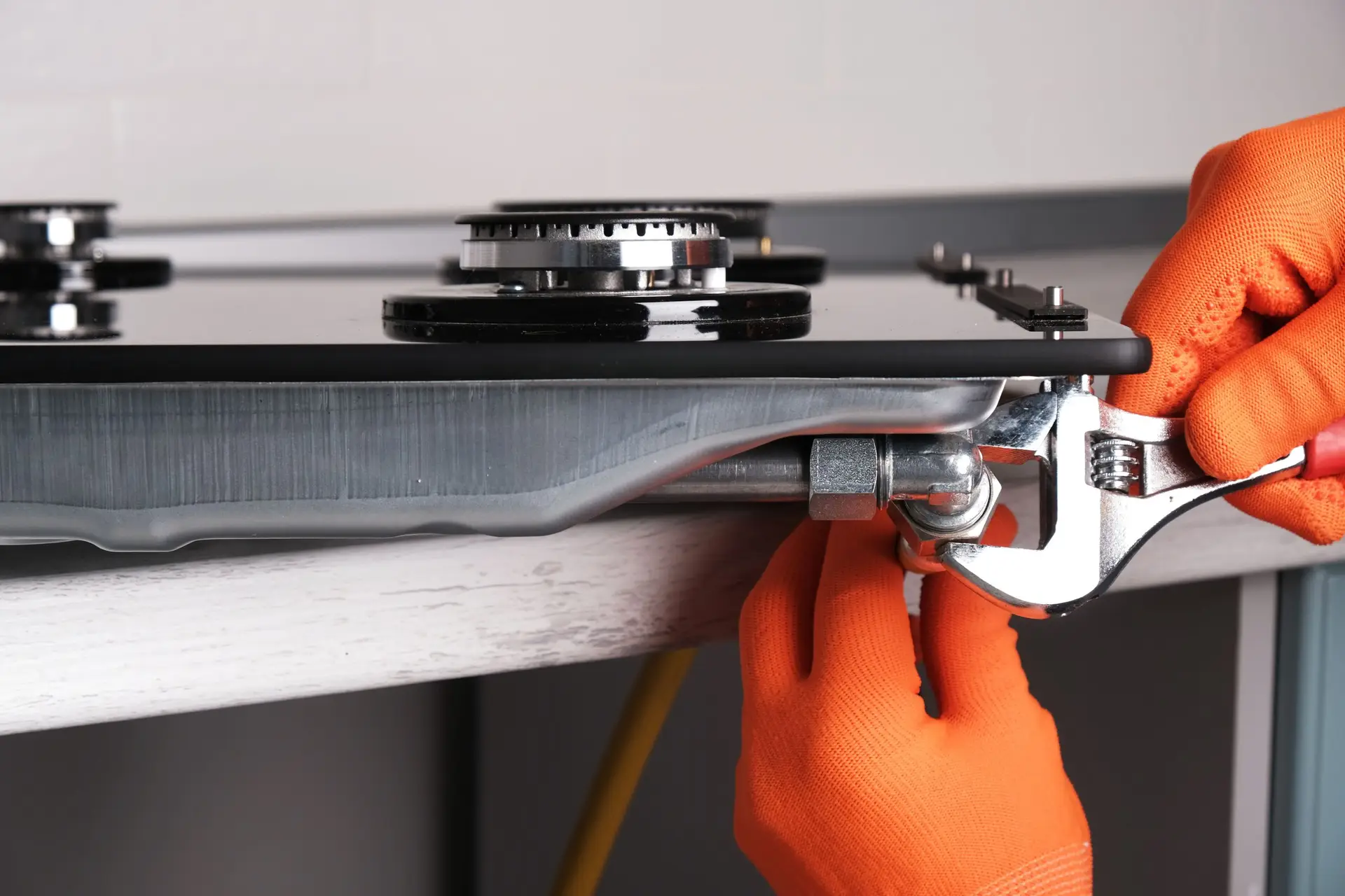 Connecting a gas hose to a hob — gas hob installation must be carried out by a Gas Safe registered engineer