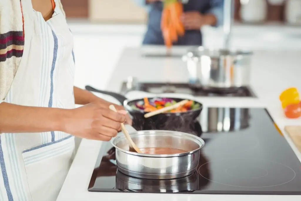 Happy couple preparing meal in the kitchen