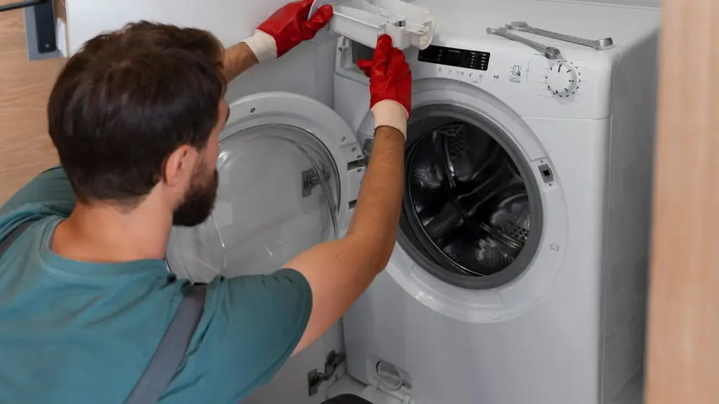 What causes limescale build-up in kitchen appliances?