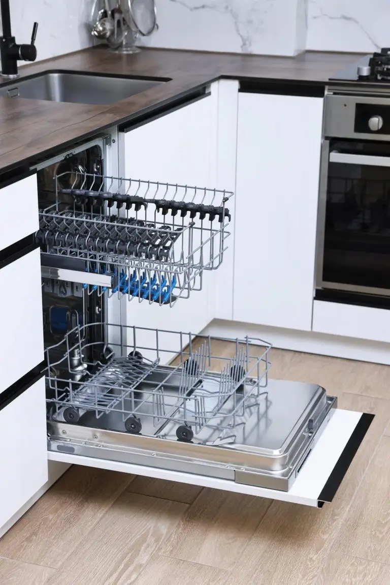 Open clean empty dishwasher in kitchen home appliance