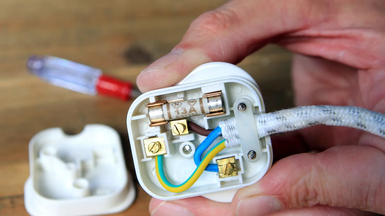 UK 13 amp plug with back taken off to change the fuse