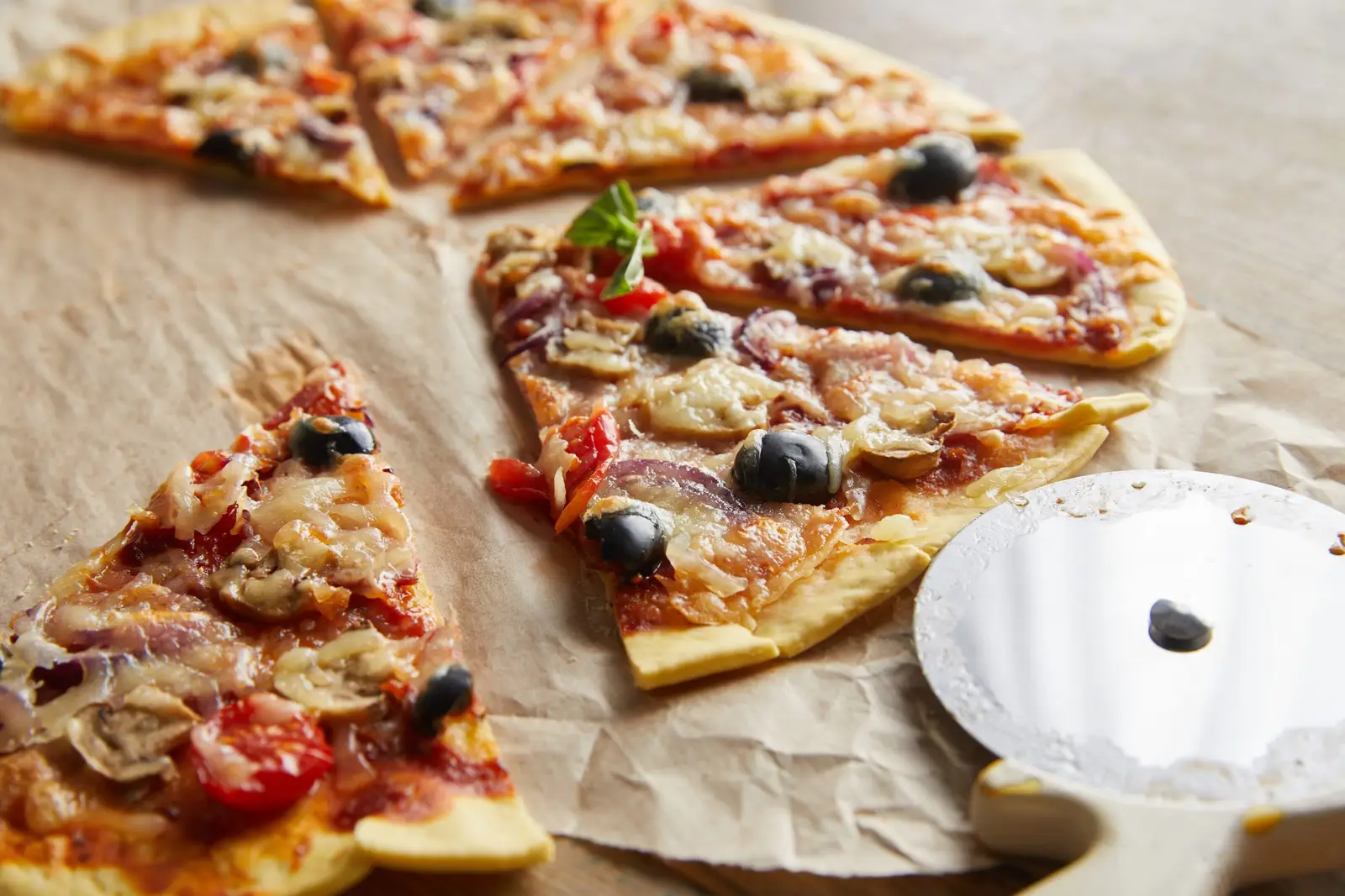 Close up of a thin crust Italian pizza with a crisp golden base