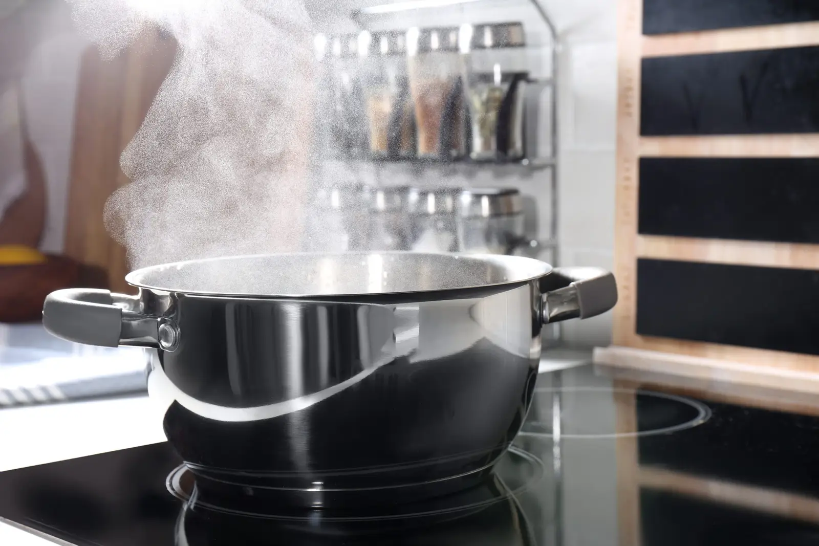 Steaming pot of water on an induction hob in a bright kitchen — Boost mode brings large volumes of water to the boil in roughly half the time of a standard high setting