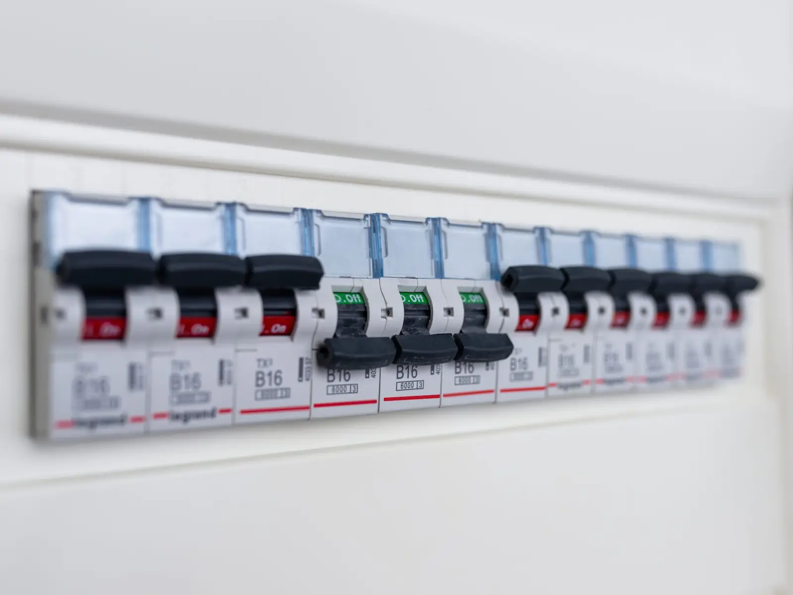 Switches in an electrical consumer unit fuse box — circuit breakers protect against overcurrent and earth leakage faults from kitchen appliances